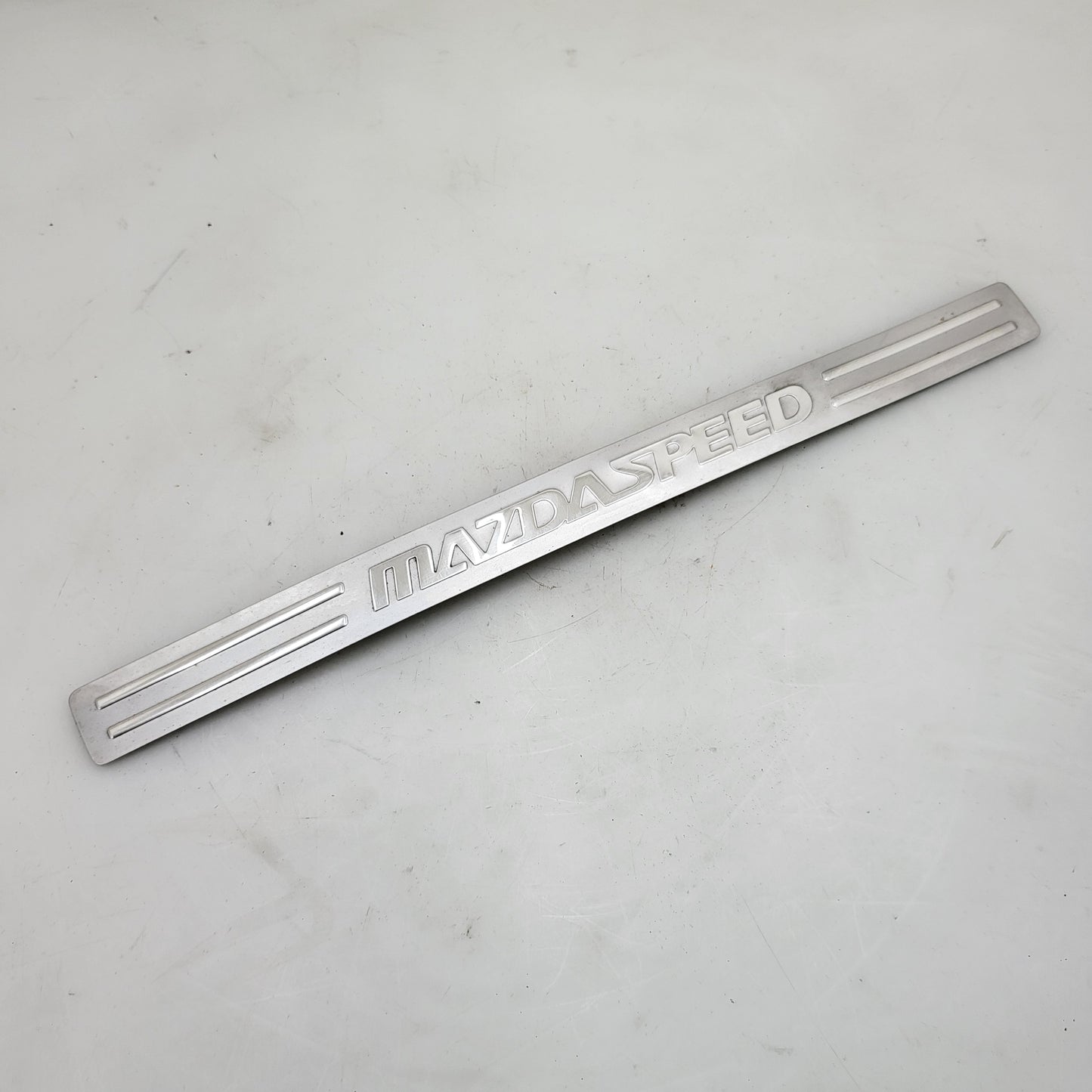 OEM Mazdaspeed 3 gen 2 driver side front door scuff plate, kick panel trim